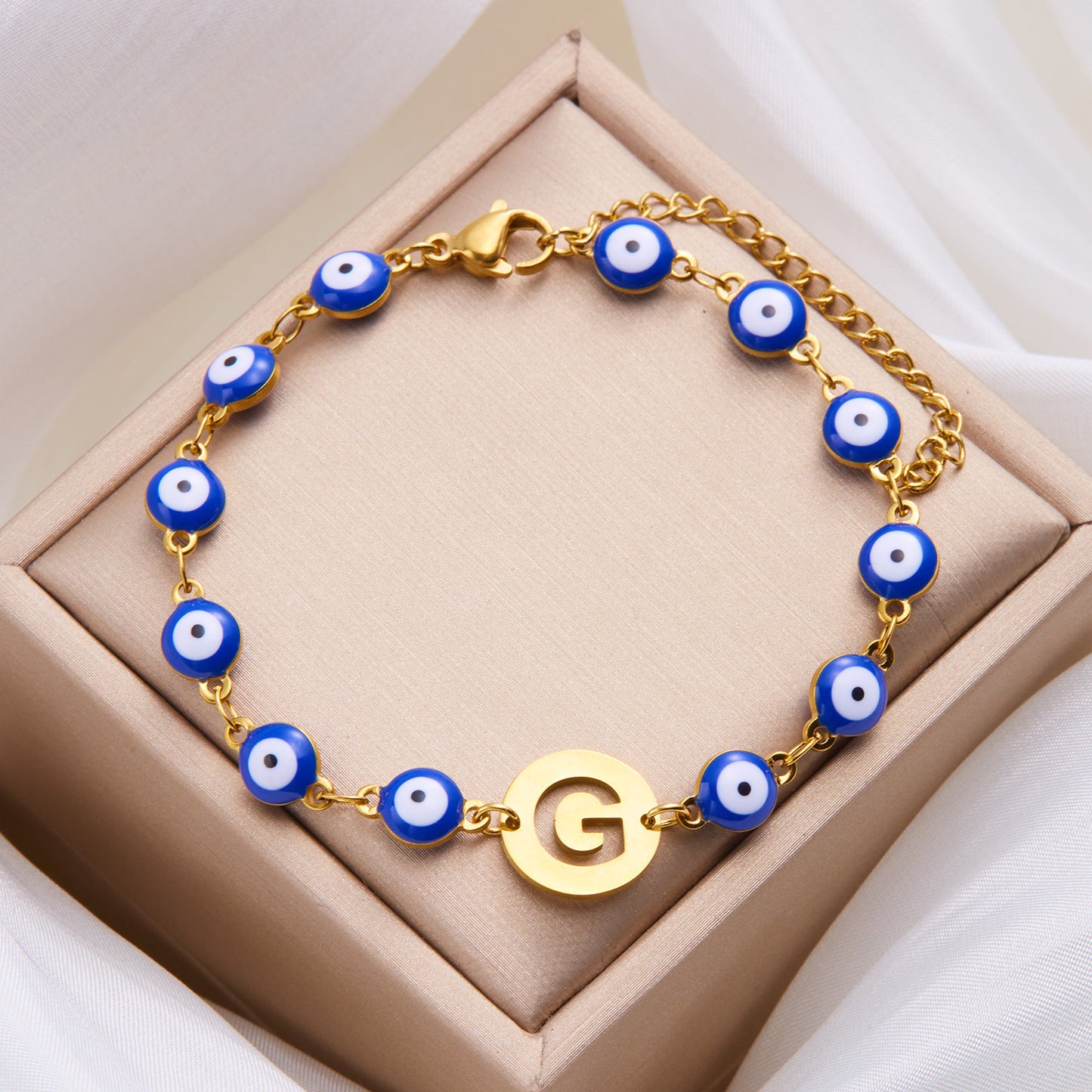 Women's High-grade Stainless Steel Blue Eyes Fashion Hollowed-out 26 Letter Bracelet c050e3c8 3e53 4b26 857c 9cef03caf5a4