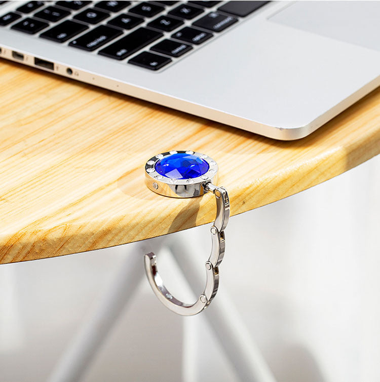 Portable And Practical Folding Crystal Bag Hanger 04a8fe9e bd32 4cab 8cb3 8a2d238ece1d