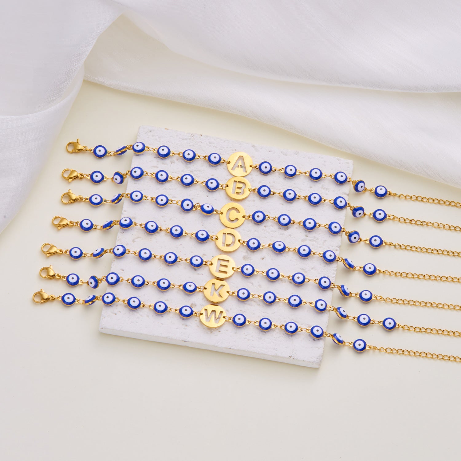 Women's High-grade Stainless Steel Blue Eyes Fashion Hollowed-out 26 Letter Bracelet 13ba7038 8140 49ff 9090 6bf52ca453b9