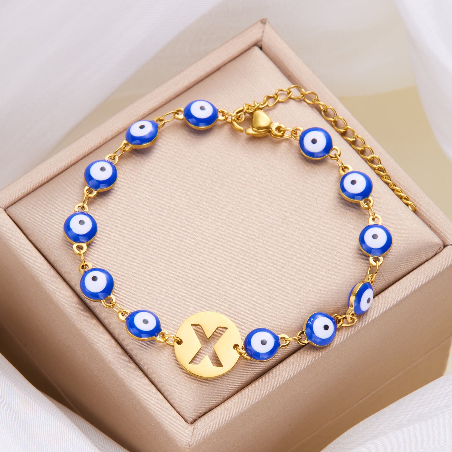 Women's High-grade Stainless Steel Blue Eyes Fashion Hollowed-out 26 Letter Bracelet 14e2115f 150f 4c44 9d34 6e8f1159acc2