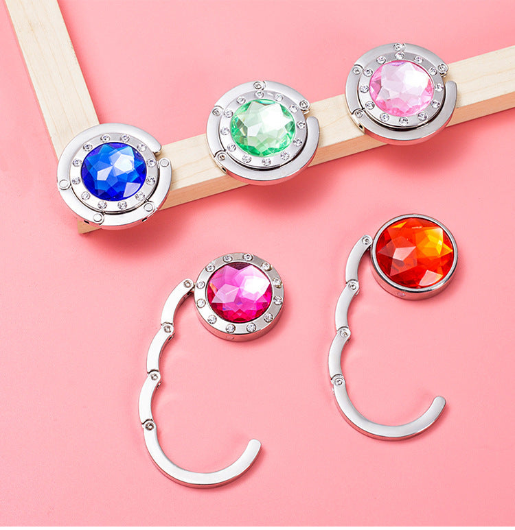 Portable And Practical Folding Crystal Bag Hanger 21203ce4 393a 49b9 bc44 a9745d606d15