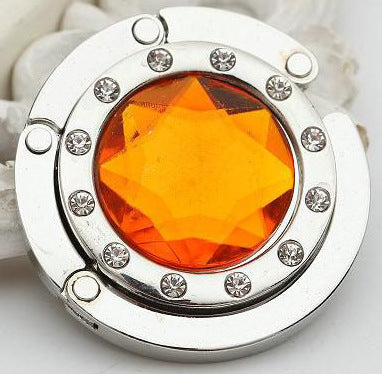 Portable And Practical Folding Crystal Bag Hanger 42f94ba0 28c6 45f4 990c d6b128955d26