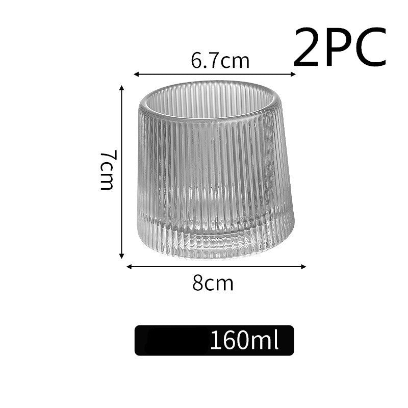 Thickened rotating tumbler whiskey glass 6b884045 c45a 4d41 81d3 9ab460b9d87d