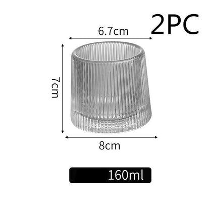 Thickened rotating tumbler whiskey glass 6b884045 c45a 4d41 81d3 9ab460b9d87d