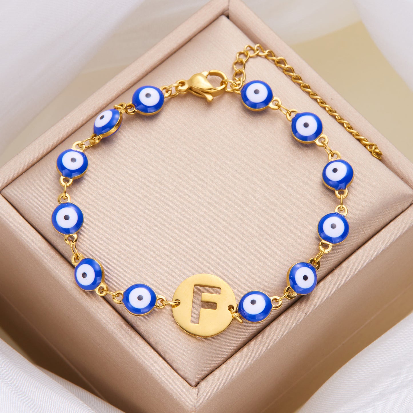 Women's High-grade Stainless Steel Blue Eyes Fashion Hollowed-out 26 Letter Bracelet 8e5373a7 884e 4a52 a781 7667109acad6