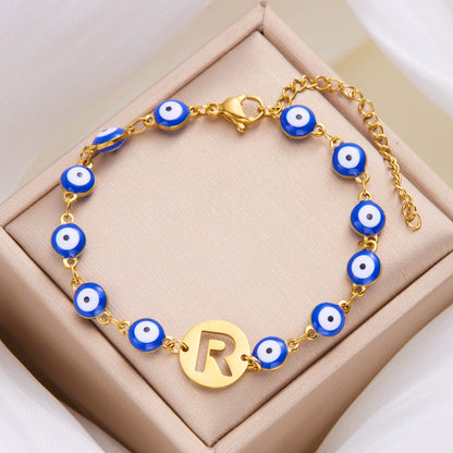 Women's High-grade Stainless Steel Blue Eyes Fashion Hollowed-out 26 Letter Bracelet eb3c7788 a4d9 4326 bd69 2711dd5bd6fb